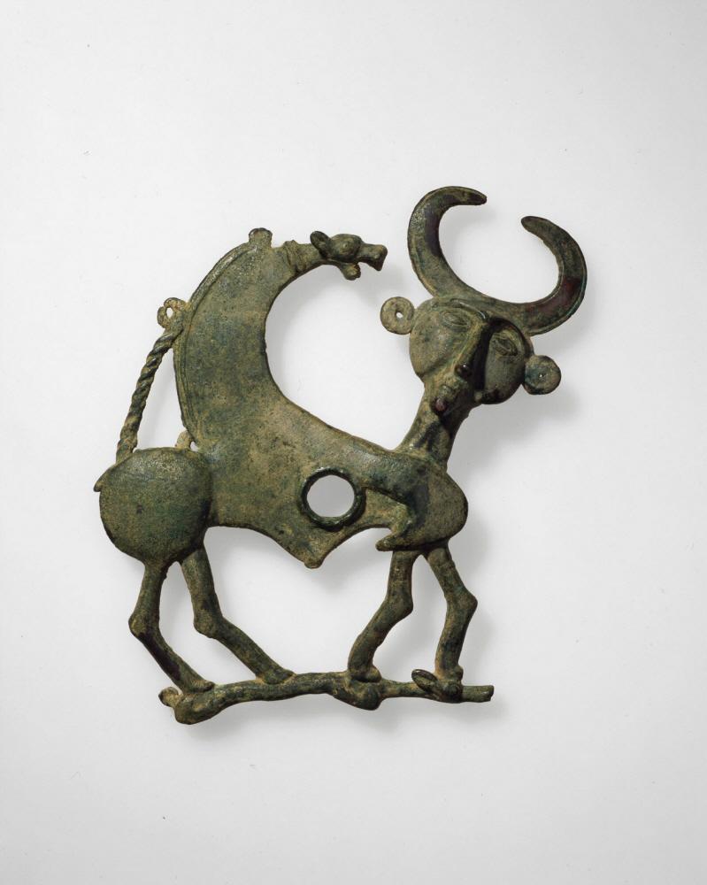 Cheekpiece of a horse bridle in the form of a mythical creature.