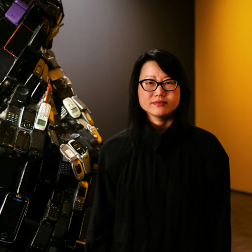 Portrait of Jean Shin in front of her installation.