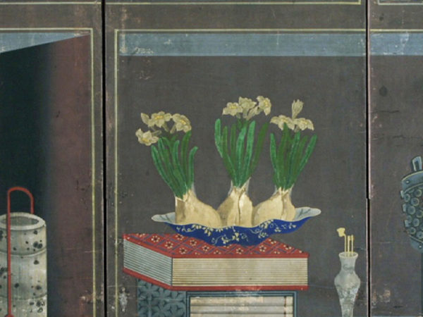 Detail of a painting featuring three flowering bulbs in a dish.